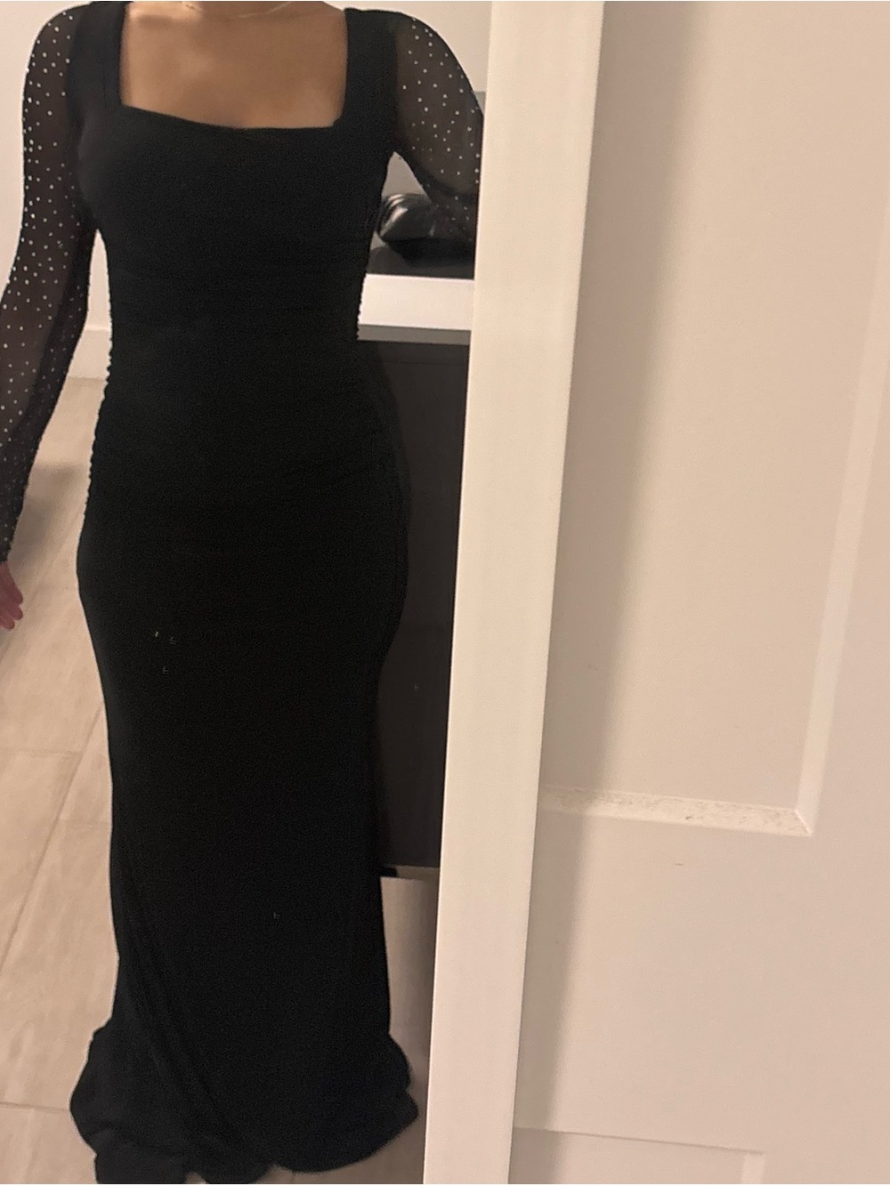 Elegant Black Long Sleeve Evening Dress with Sheer Polka Dot Sleeves